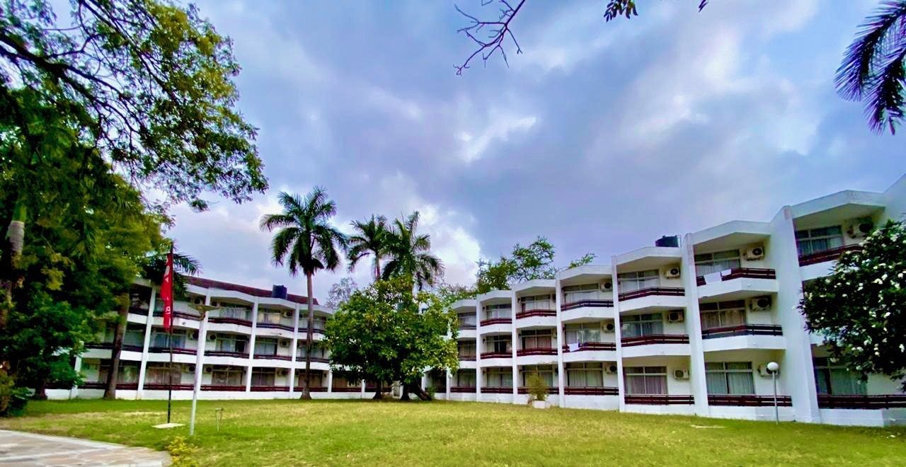 Standard room block with balconies and gardens at Kenya Bay Beach Hotel