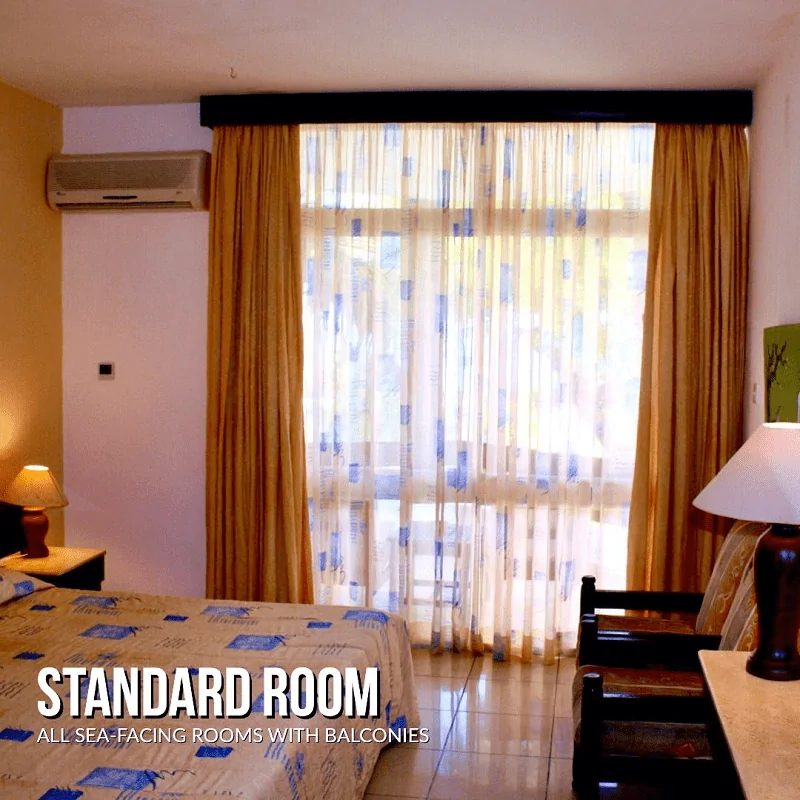 Standard single room with balcony doors at Kenya Bay Beach Hotel, Bamburi Beach